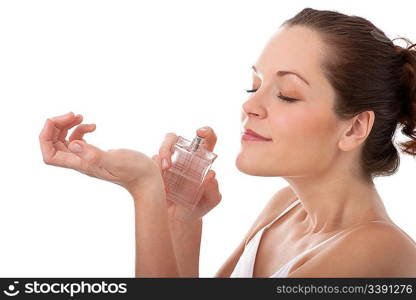 Young woman applying perfume on her wrist