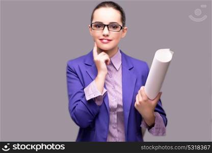 Young woman architect on gray background