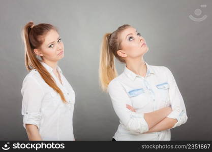 Young woman asking apologize to her offended friend after quarrel. Interpersonal conflict, bad relationships, friendship difficulties concept.. woman asking apologize to her offended friend after quarrel.