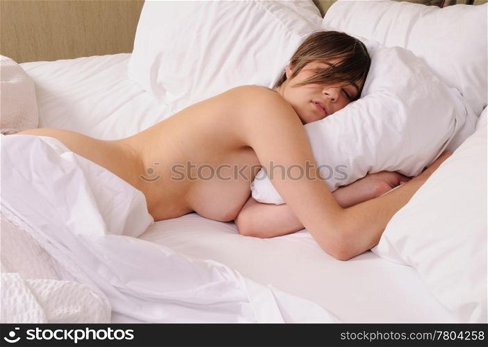 Young woman asleep in bed