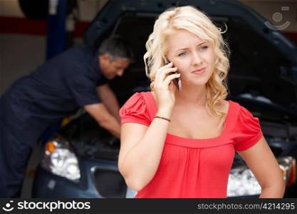 Young woman at auto repair shop