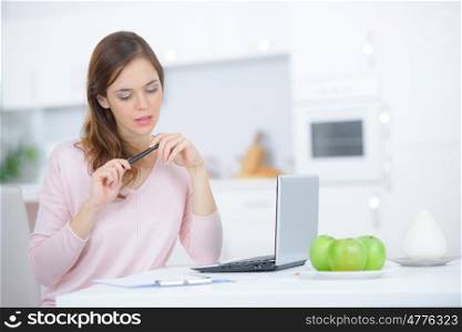 young woman at home online shopping