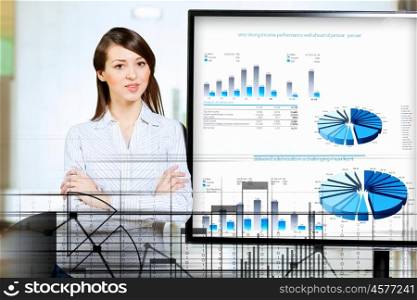 Young woman at presentation. Image of young woman making presentation on screen