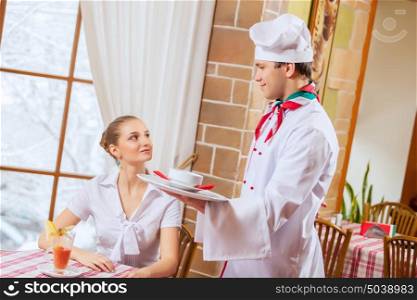 Young woman at restaurant. Young woman at restaurant sitting at table