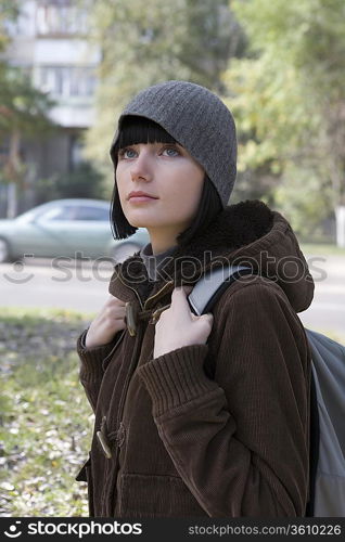 Young woman at street in winter clothing