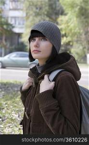 Young woman at street in winter clothing