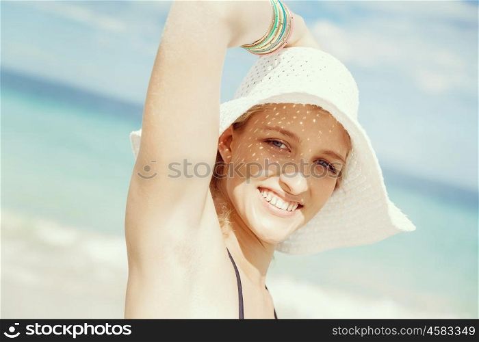 Young woman at the beach. Portrait of young pretty woman at the beach