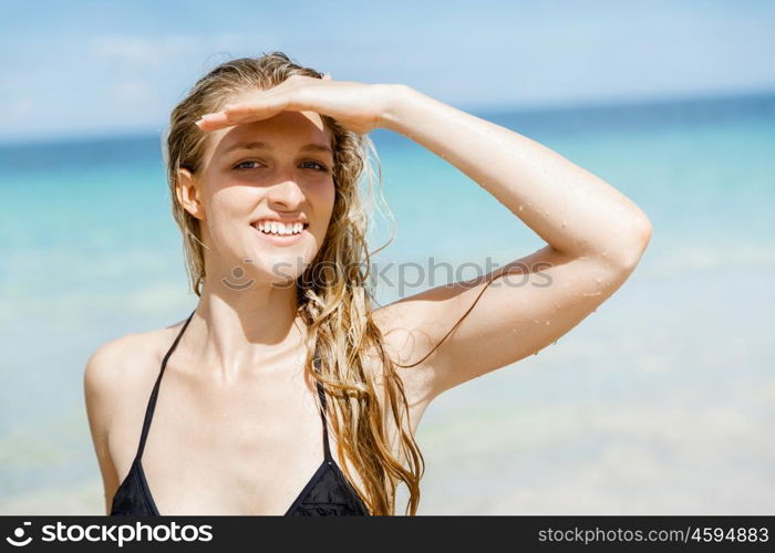 Young woman at the beach. Portrait of young pretty woman at the beach