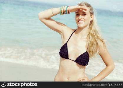 Young woman at the beach. Portrait of young pretty woman at the beach