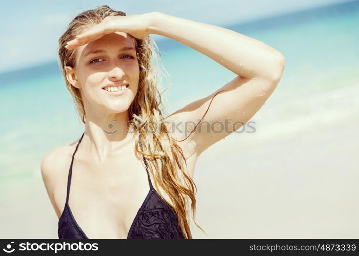 Young woman at the beach. Portrait of young pretty woman at the beach