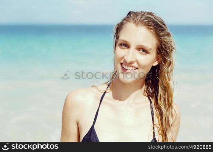 Young woman at the beach. Portrait of young pretty woman at the beach