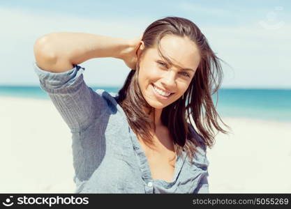 Young woman at the beach. Portrait of young pretty woman at the beach