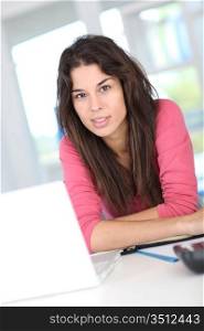 Young woman at work in front of laptop computer