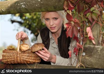 young woman back from woods with mushrooms