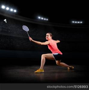 Young woman badminton player (in sports hall version)
