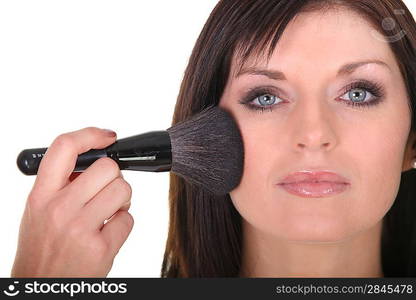 Young woman being makeup