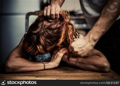 Young woman being the victim of domestic abuse