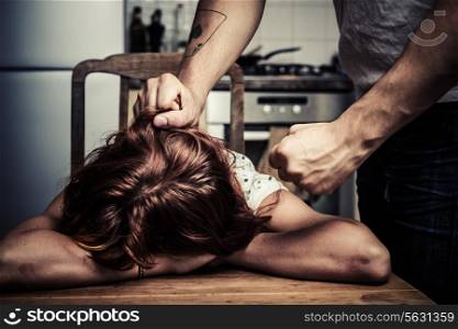 Young woman being the victim of domestic abuse