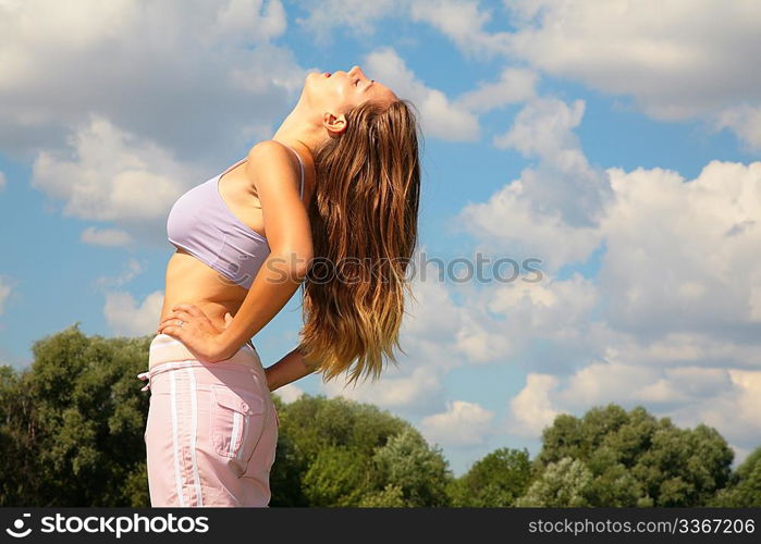 Young woman bend back