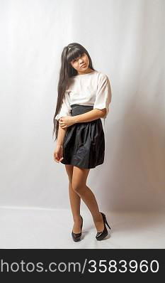 Young woman black skirt. Portrait of asian woman.