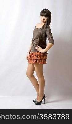 Young woman brown skirt. Portrait of asian woman.