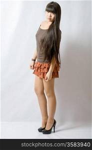Young woman brown skirt. Portrait of asian woman.