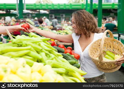 Young Woman Buying Tomato at Grocery Market