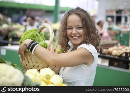 Young Woman Buying Vegetables at Grocery
