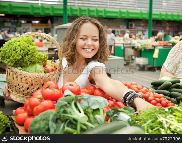 Young Woman Buying Vegetables at Grocery Market