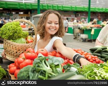 Young Woman Buying Vegetables at Grocery Market