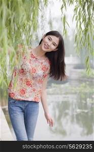 Young Woman By a Canal Smiling