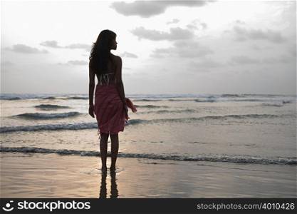 Young woman by the sea