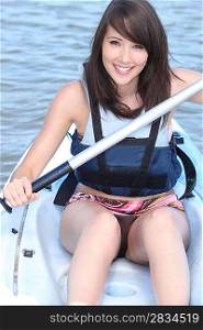 young woman canoeing