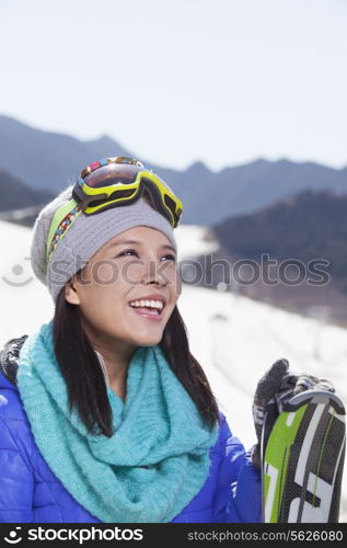 Young Woman Carrying Her Skis