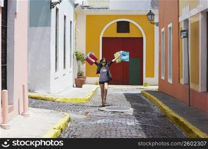 Young woman carrying shopping bags, Old San Juan, San Juan, Puerto Rico