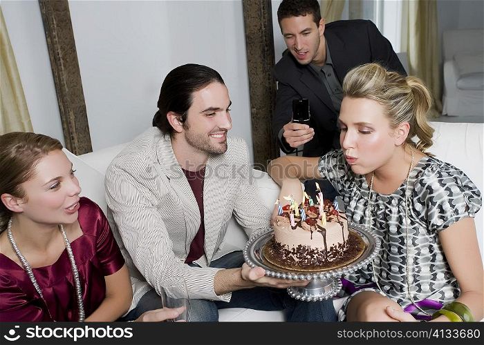 Young woman celebrating a birthday party with her friends