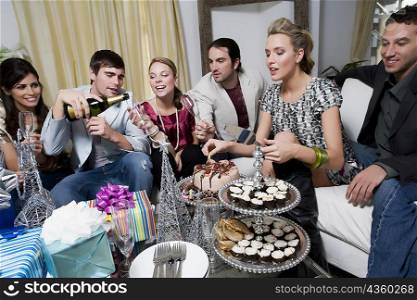 Young woman celebrating birthday with her friends