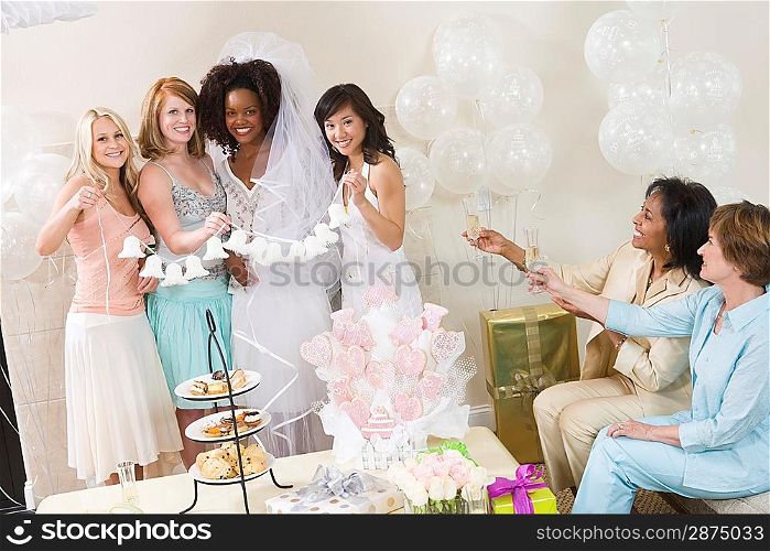 Young woman celebrating bridal shower with friends