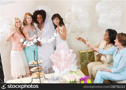 Young woman celebrating bridal shower with friends