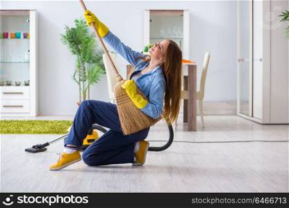 Young woman cleaning floor at home doing chores