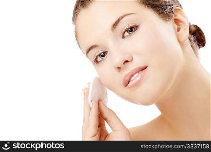 Young woman clears a face skin, isolated