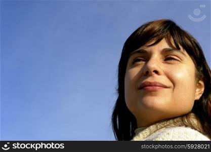 young woman close up portrait enjoying the sun