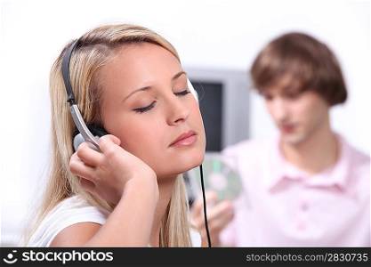 Young woman completely enthralled by a song