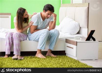Young woman consoling disappointed impotent husband 