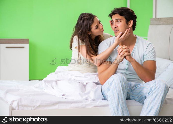 Young woman consoling disappointed impotent husband 