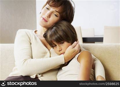 Young woman consoling her daughter