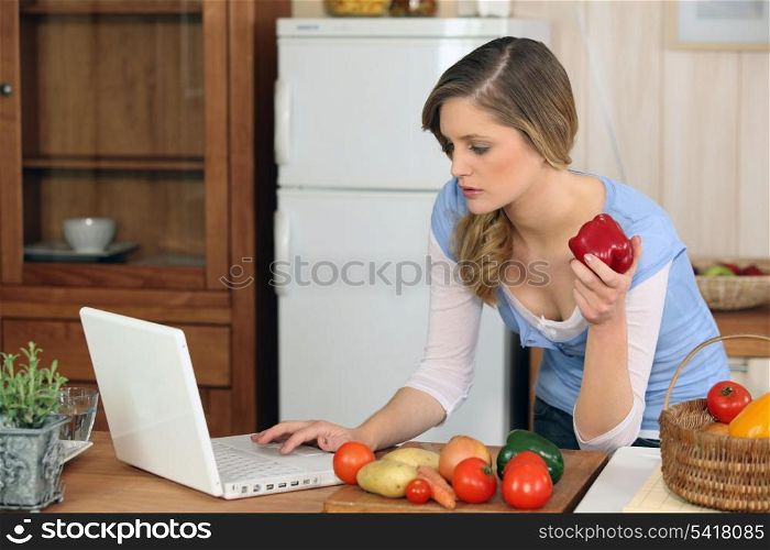 young woman cooking at home