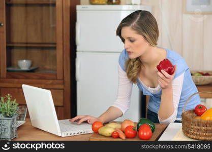 young woman cooking at home