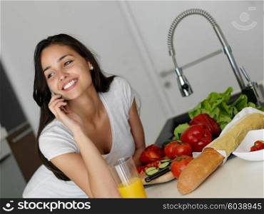 Young Woman Cooking in the kitchen. Healthy Food - Vegetable Salad. Diet. Dieting Concept. Healthy Lifestyle. Cooking At Home. Prepare Food