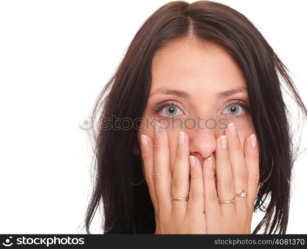 Young woman covering her mouth with both hands isolated over white background